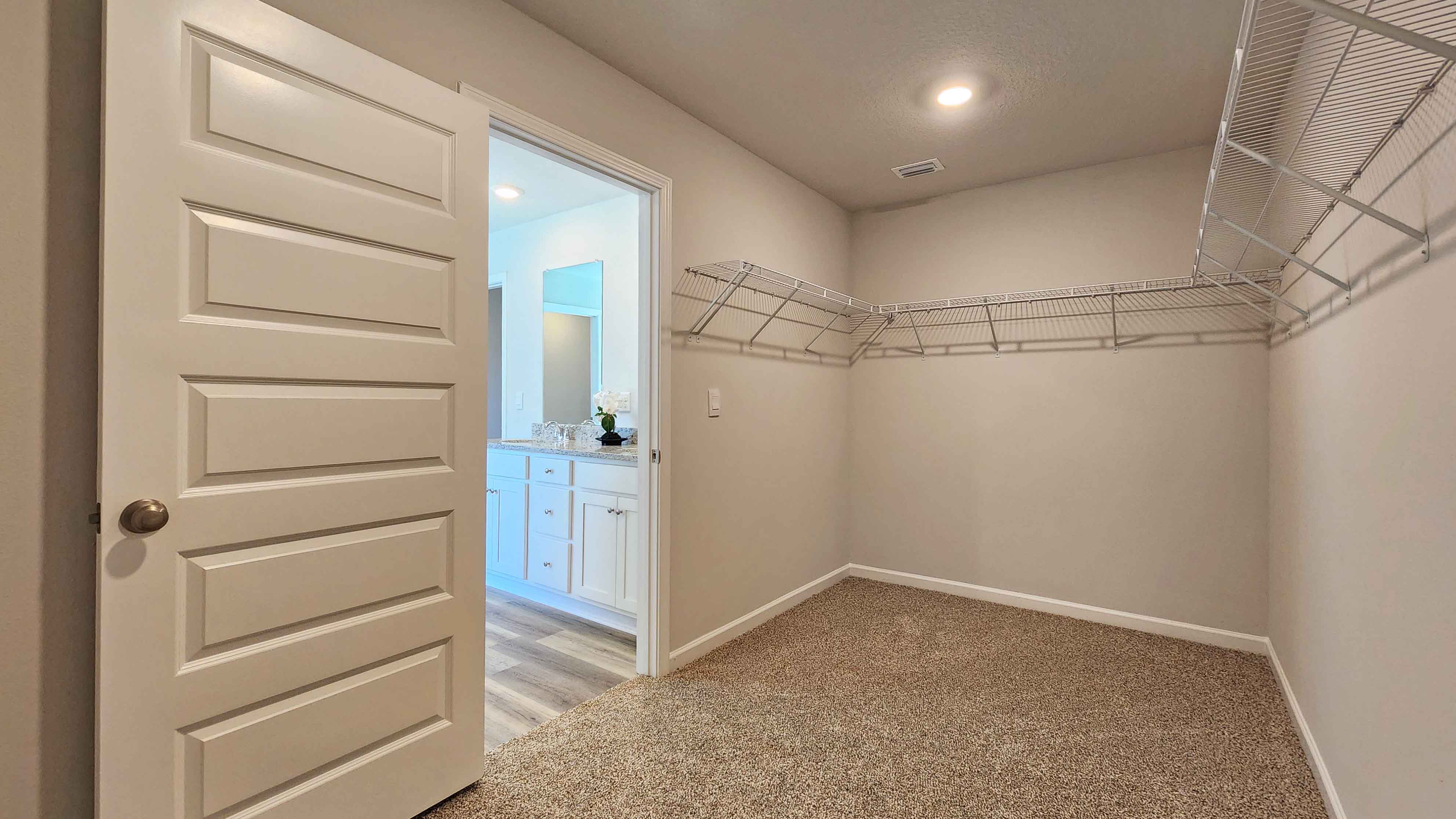 Spacious walk in closet connect to primary suite