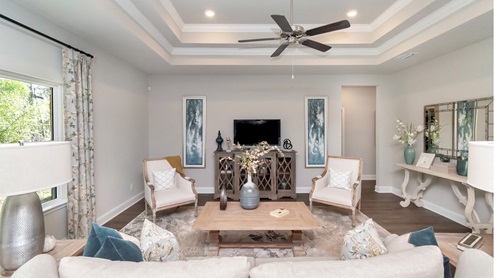 Double tray ceilings inside the living area of the Katherine floorplan.