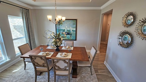 Front dining room with windows and trey ceiling.