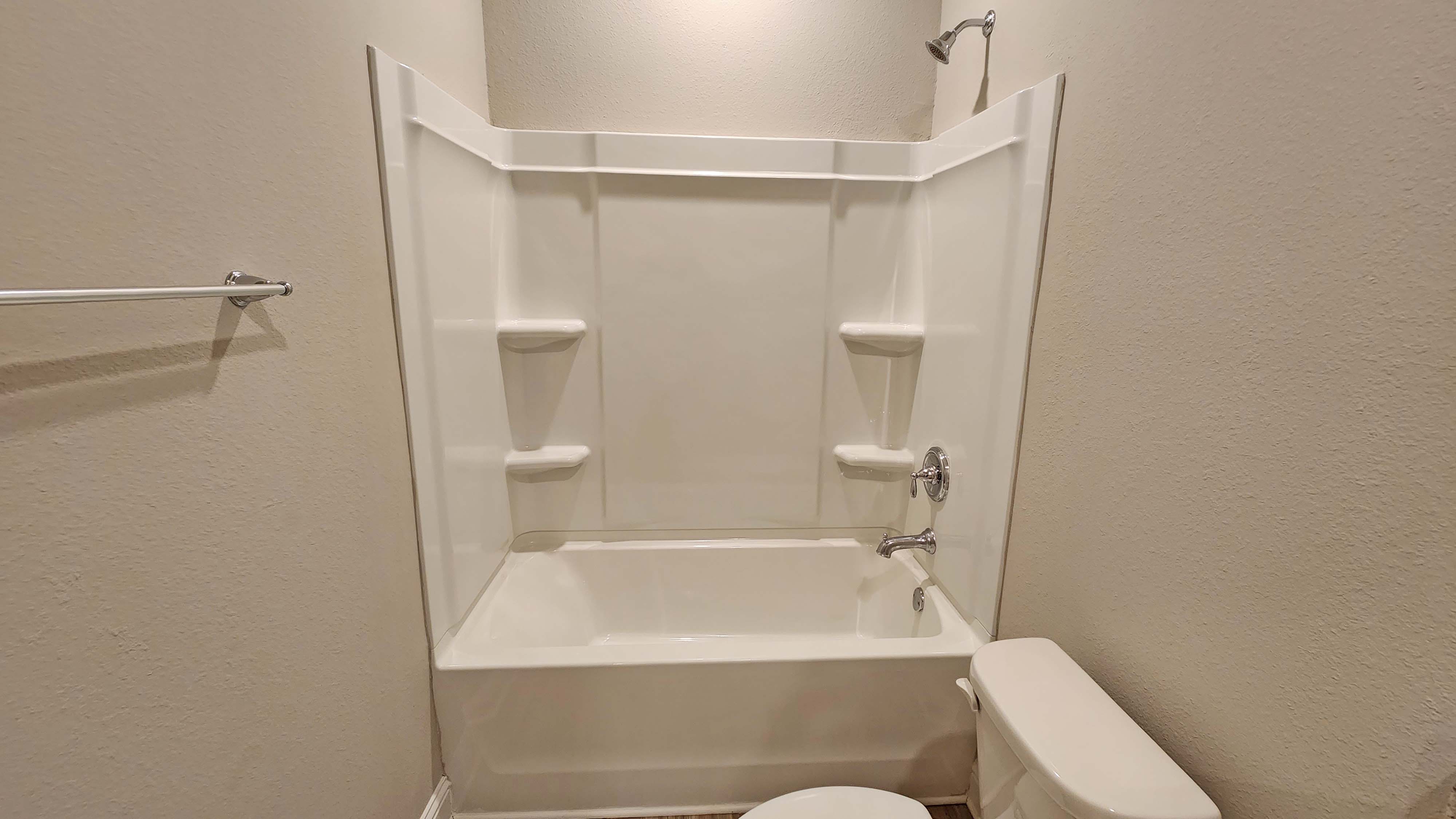 Sleek and clean shower inside the hallway bathroom