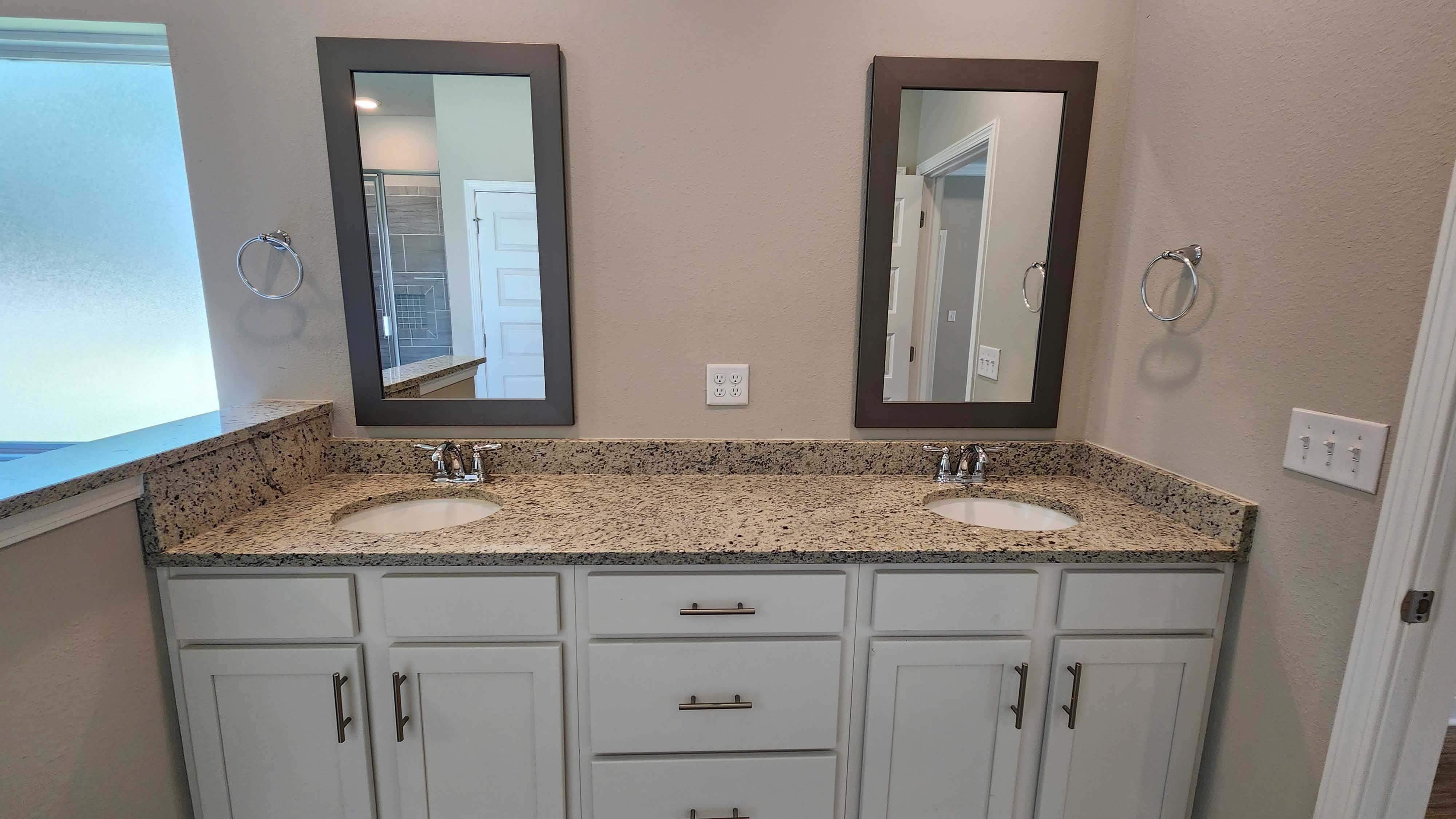 Spacious vanity space inside the primary bathroom suite