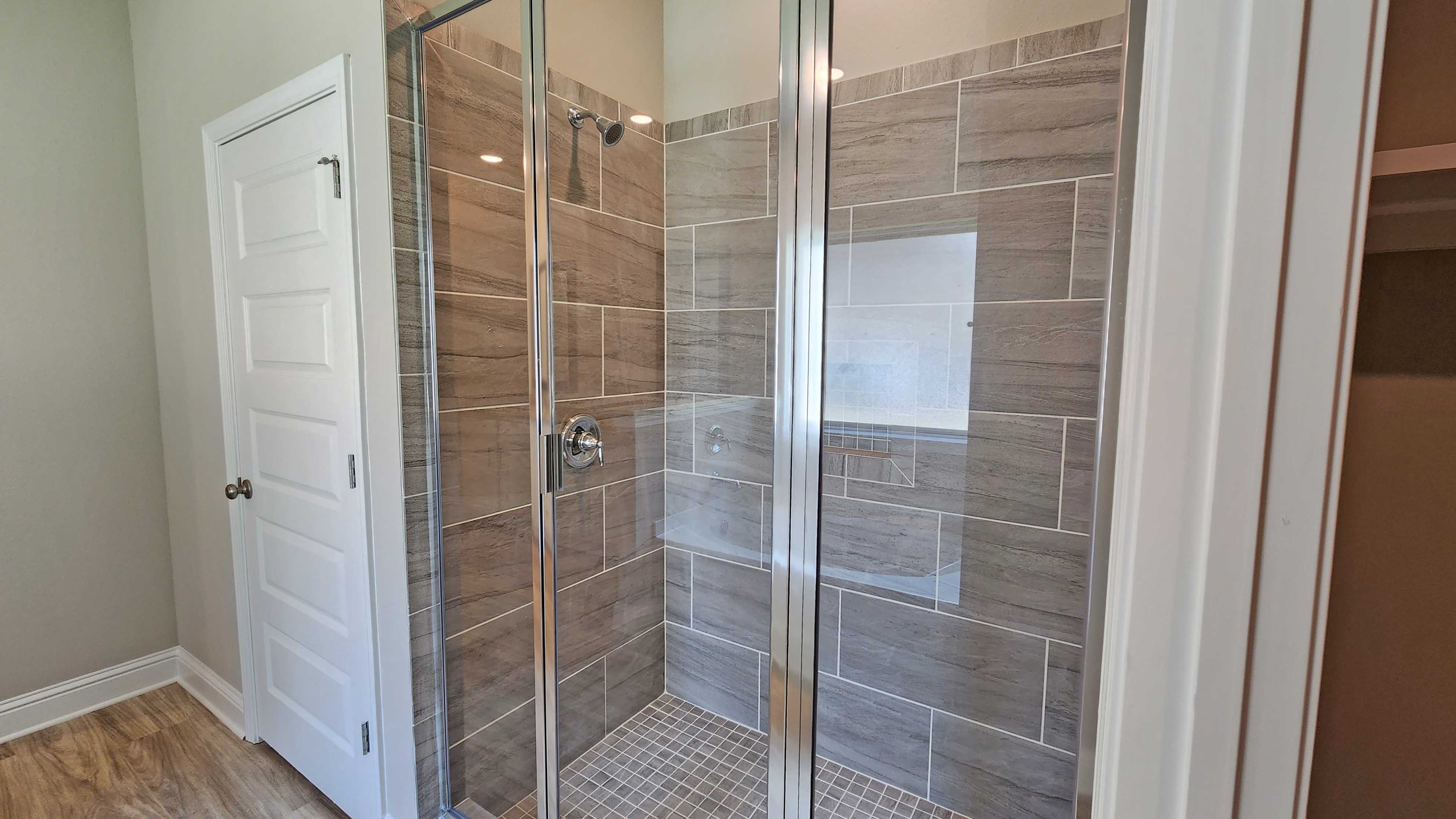 Walk in shower inside the primary bathroom suite