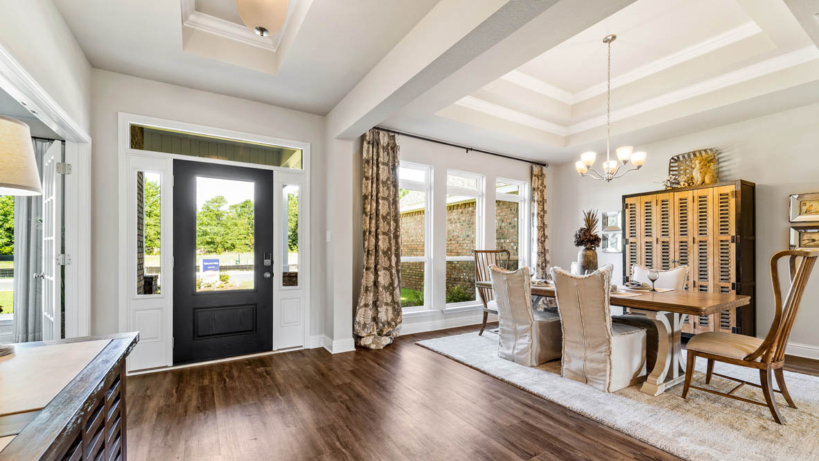 Front entry of home with dining room.