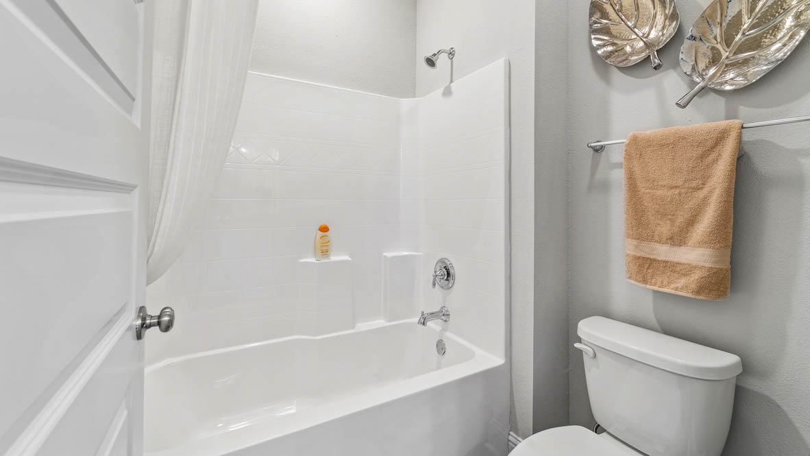 Separate area with shower/tub combination.