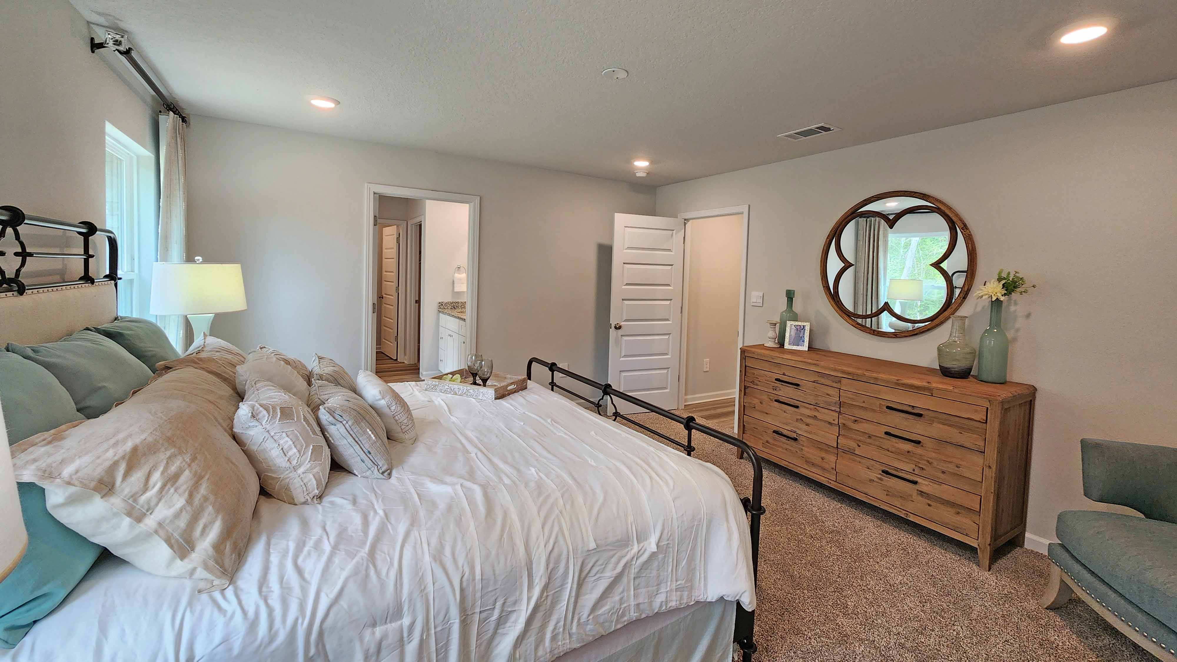 The Lakeside primary bedroom at Valor Ridge.