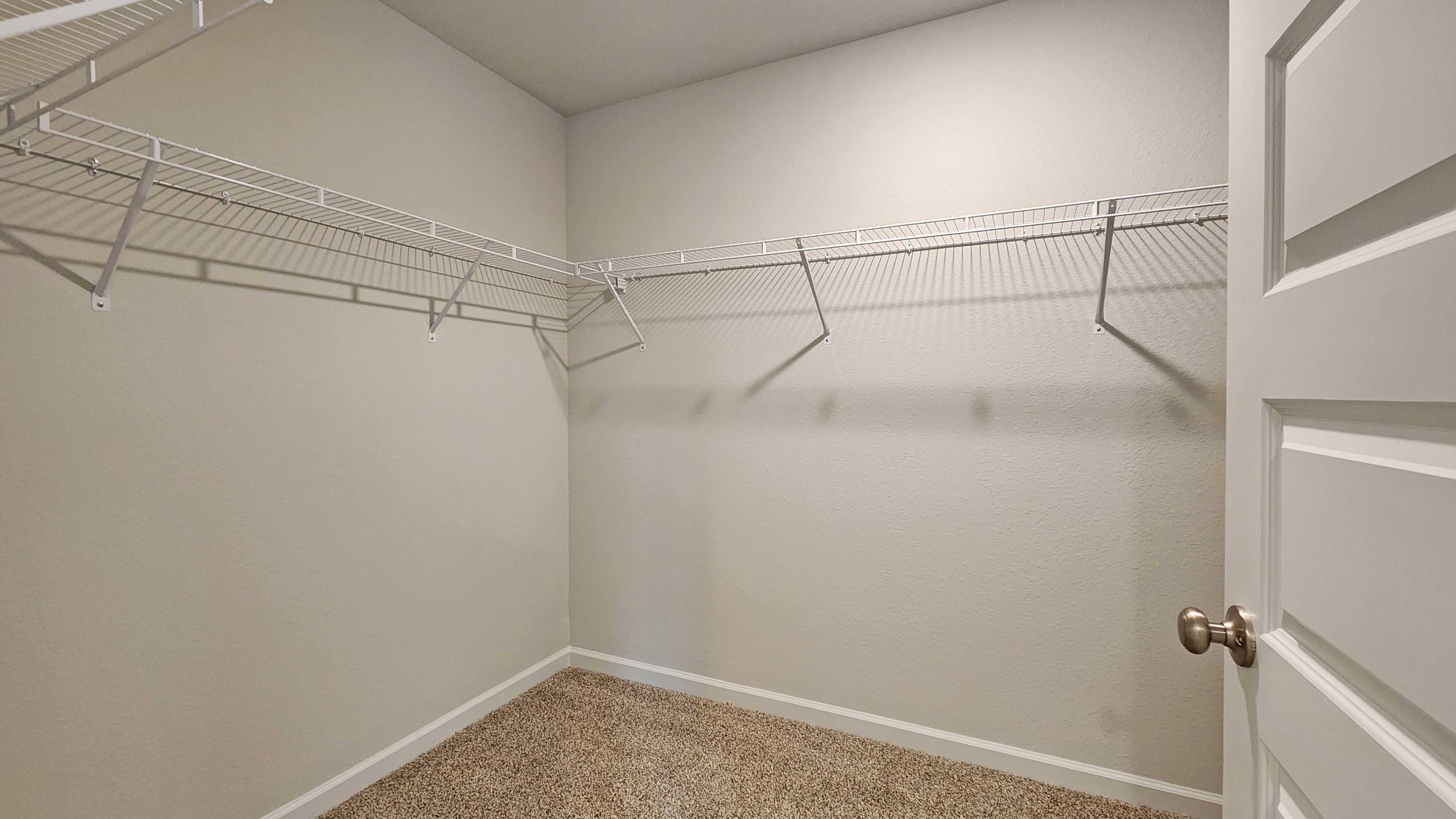 The Lakeside primary walk-in closet at Valor Ridge.