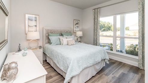 Side view of the bedroom showcasing the beautiful open window.
