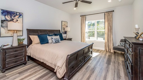 The open primary bedroom with the gorgeous open window.