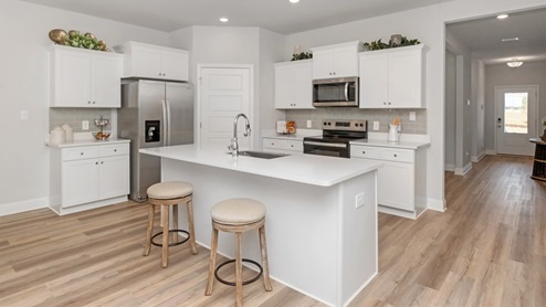 Showing the island of the gorgeous kitchen.