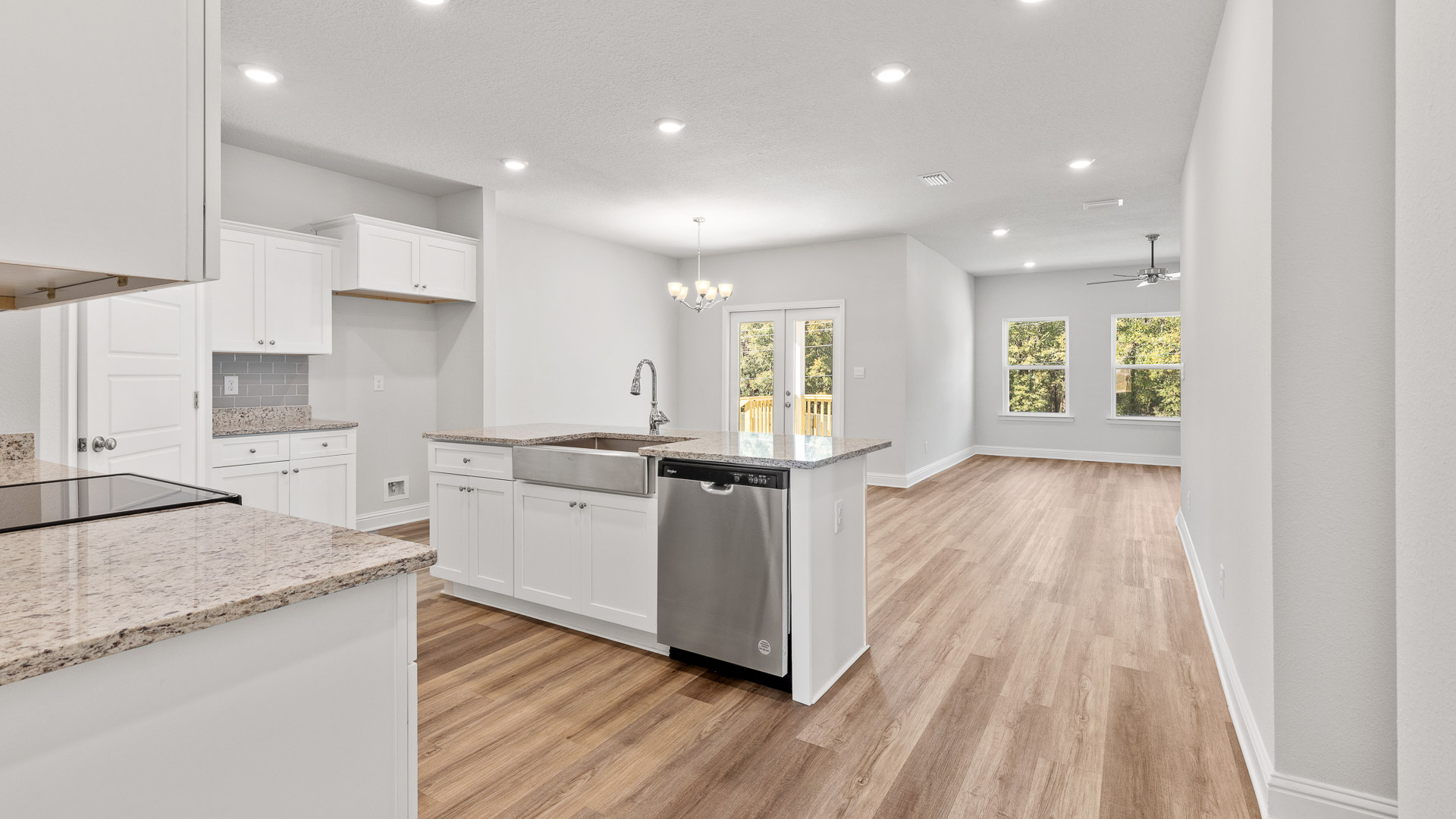 Open concept kitchen and living area with luxury vinyl plank flooring in Hawkins Manor.
