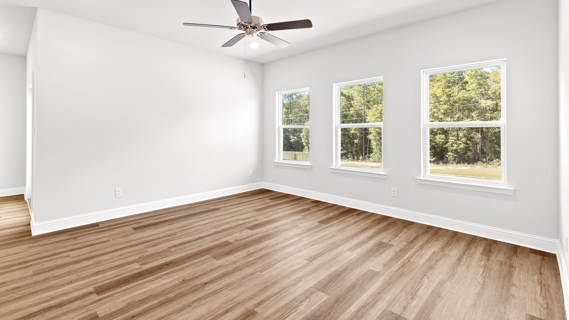 Spacious family room with lots of windows for natural light in Mobile County.