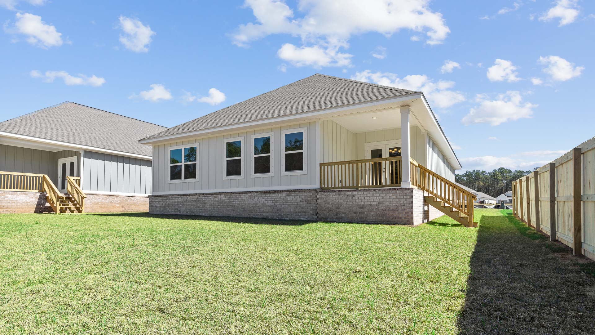 Back of new construction home with large covered patio in Hawkins Manor.