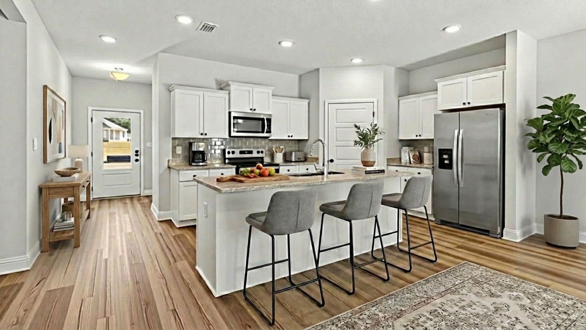 Kitchen island with stools and granite countertops.