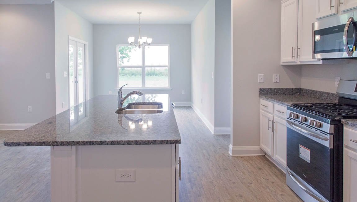 Modern kitchen with stainless steel appliances and island