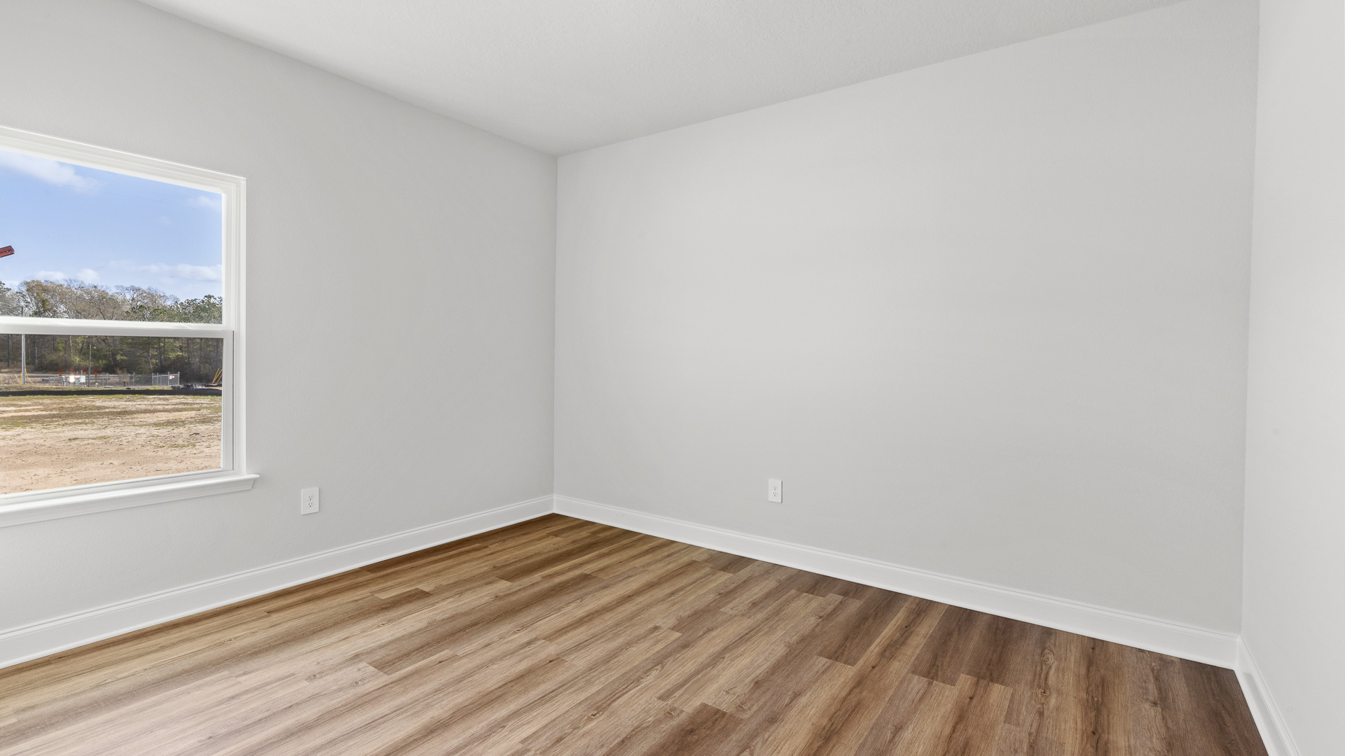Inviting guest bedroom in the Delray floorplan in Mobile.