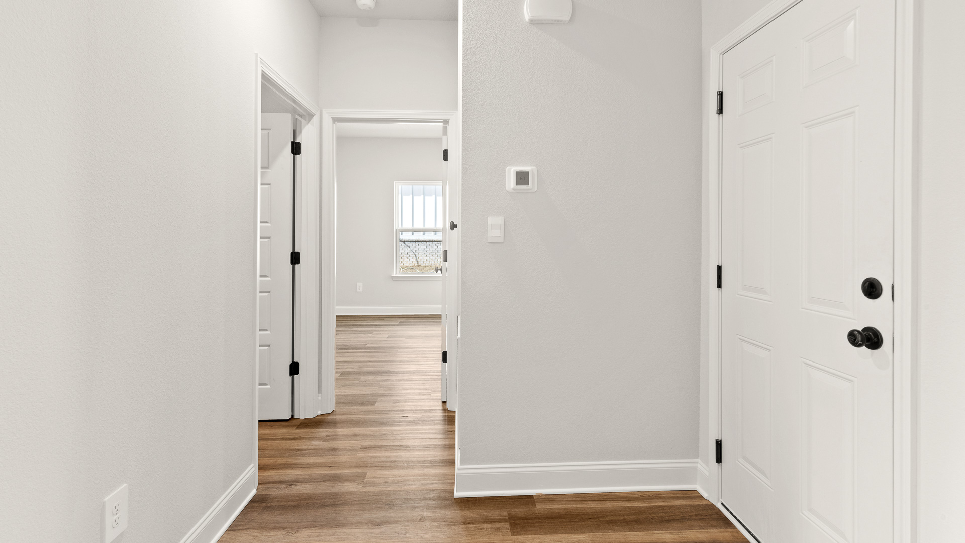 The Delray floorplan hallway to laundry room with garage access in a new community in Mobile.