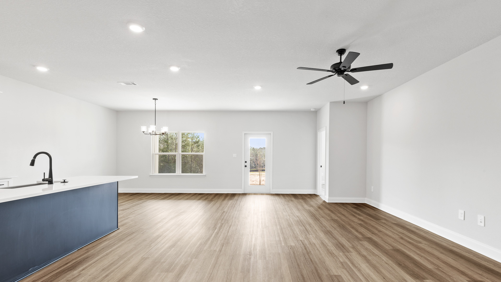 Open concept living and kitchen with family room view in Hawkins Manor.