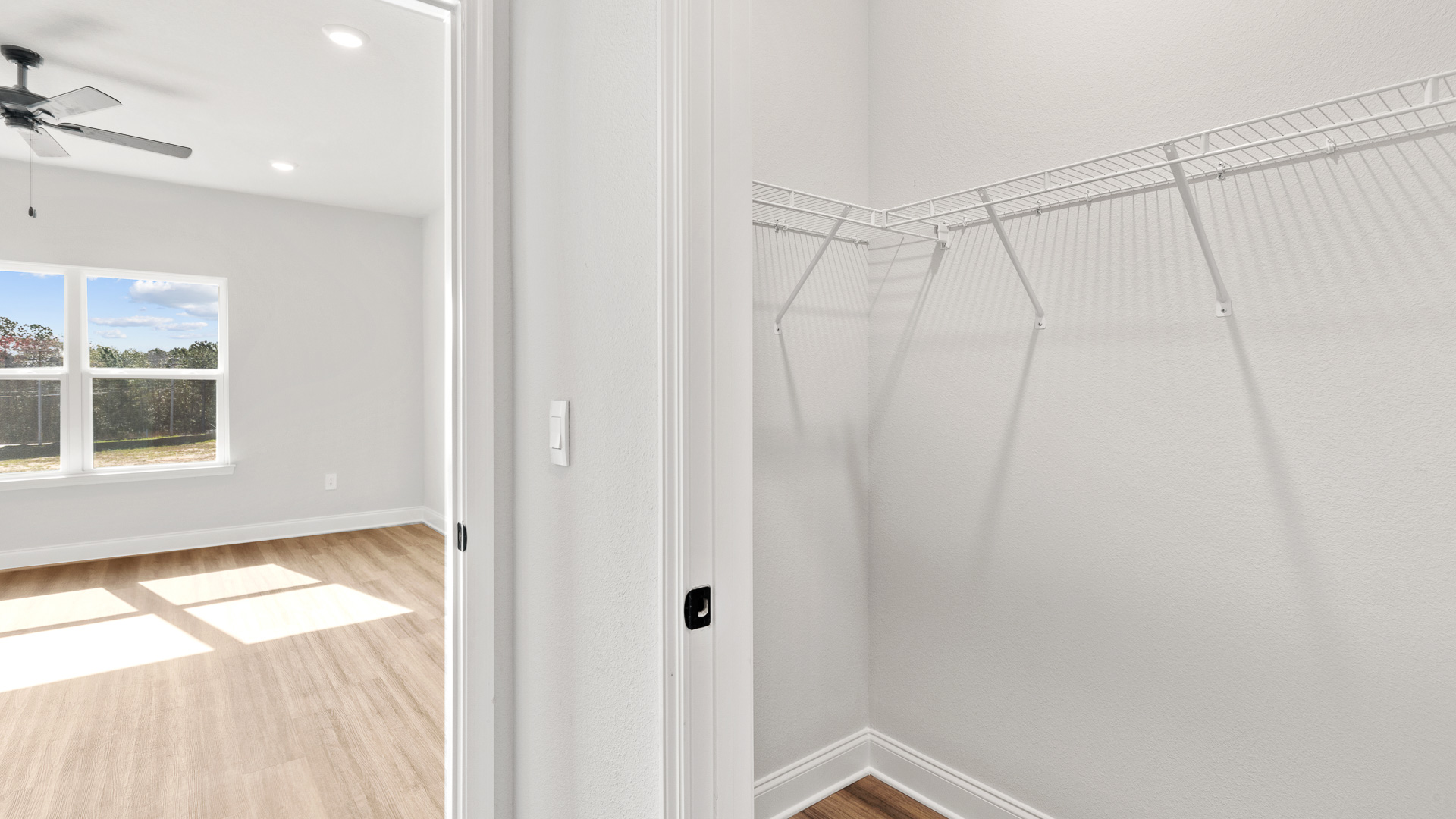 Large primary closet with shelving to accomodate the most ambitious of wardrobes in Mobile County.