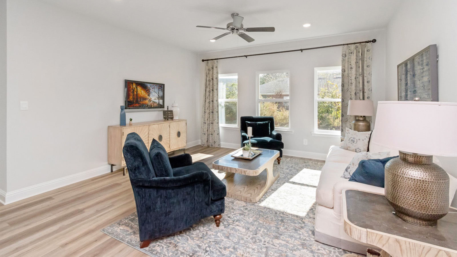 Spacious living area with white trim and neutral walls built by D.R. Horton.