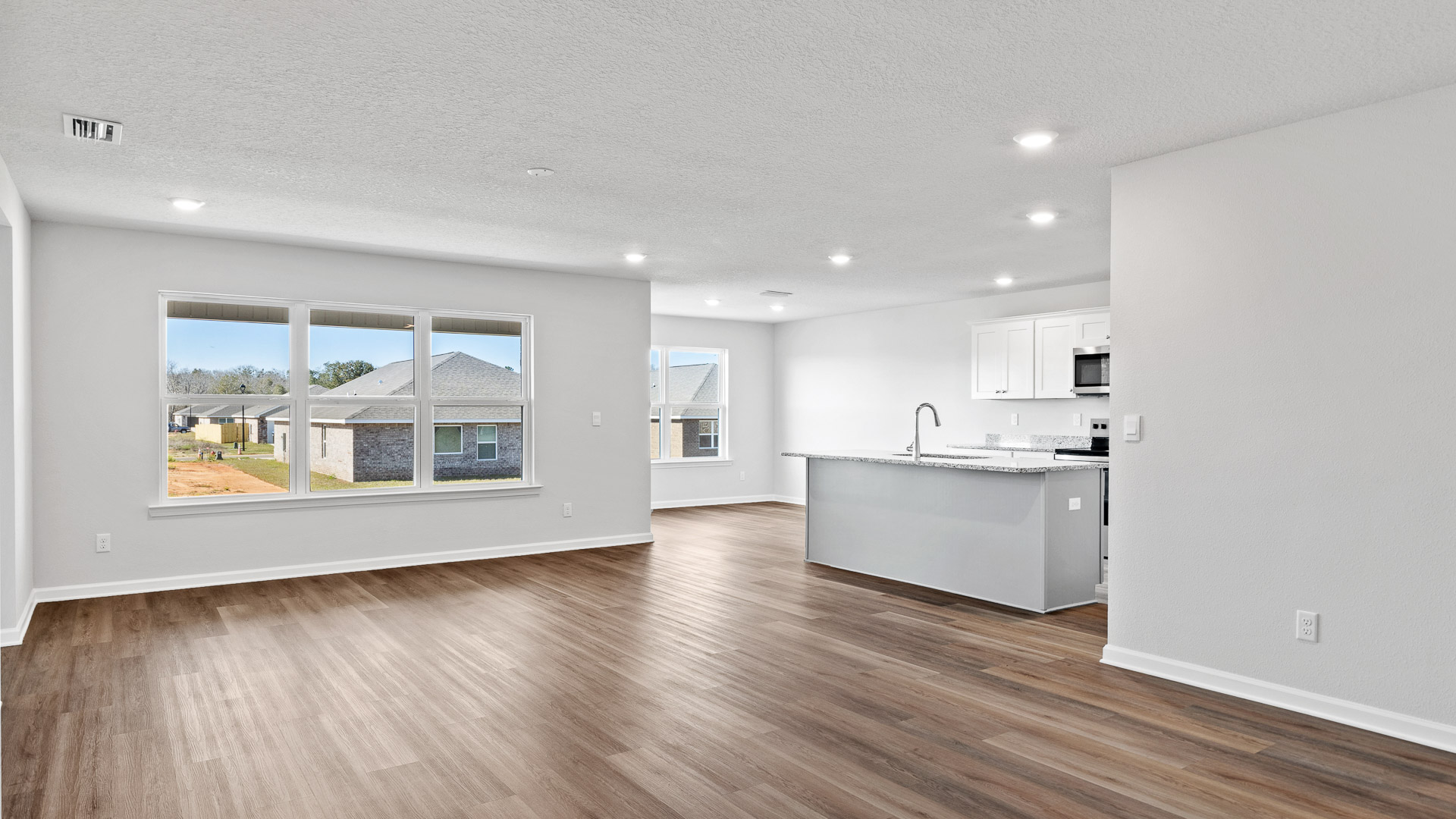 Open living area with kitchen and dining room view in Palmer Woods.