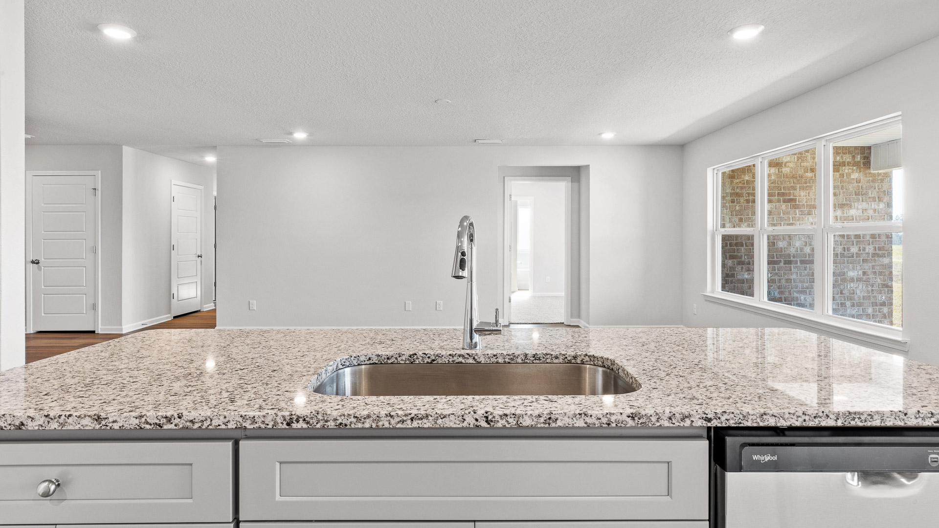 View from the large kitchen island to the open living area.