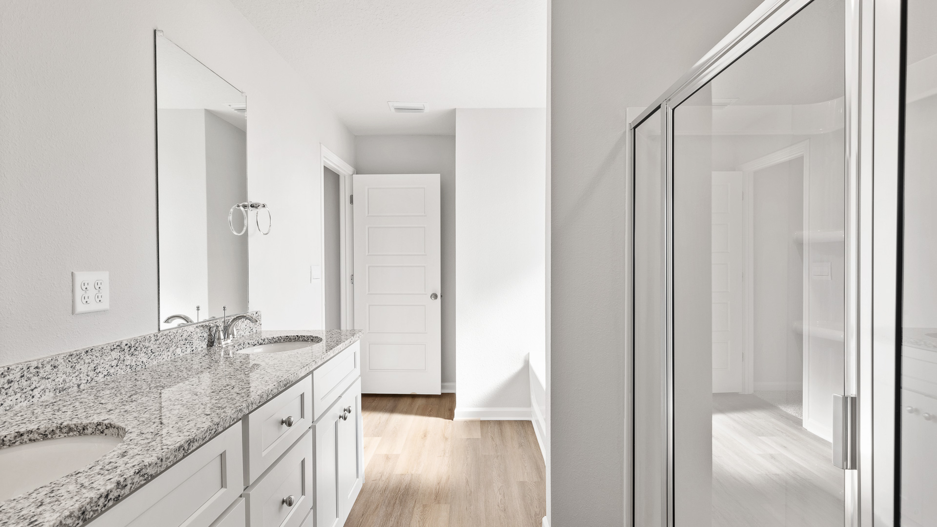 Spa like primary bathroom with soaking tub and walk in shower.