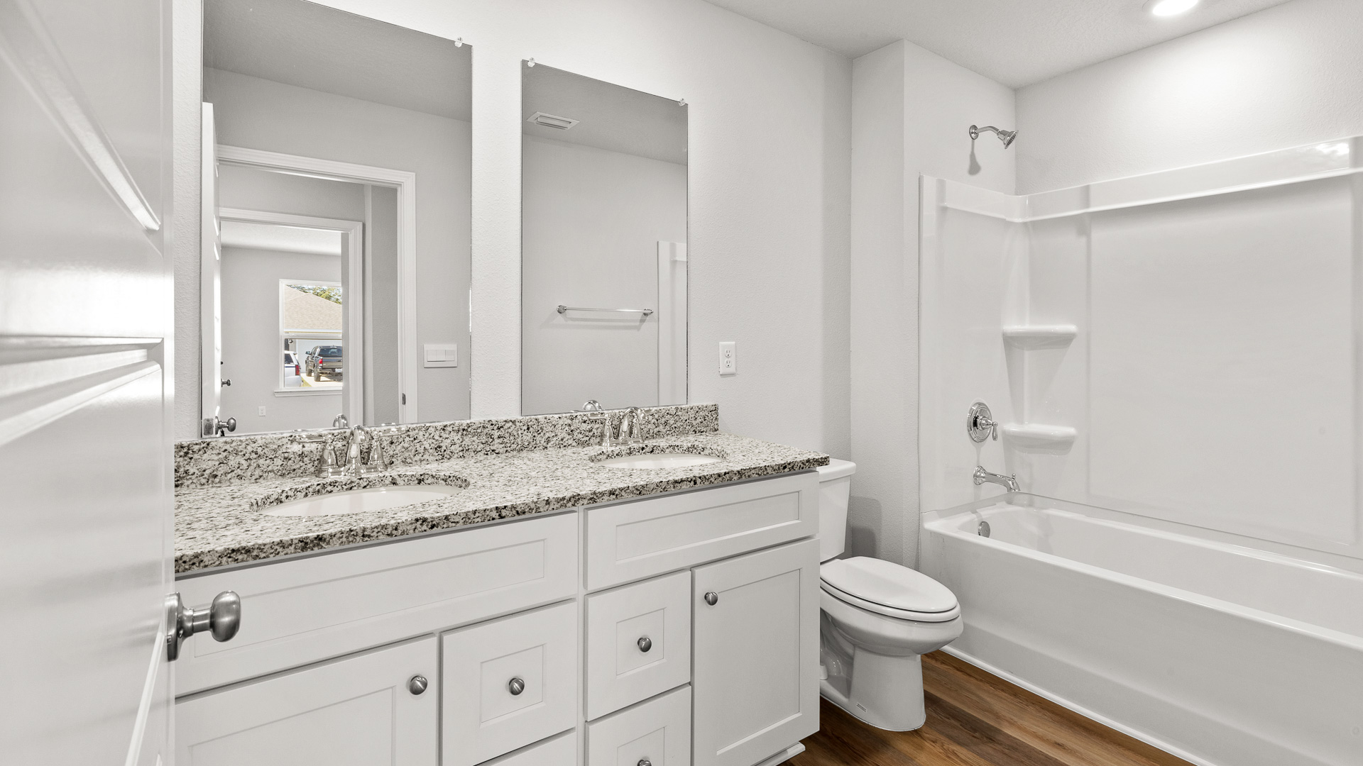 Bright guest bathroom with shower tub combo in Palmer Woods.