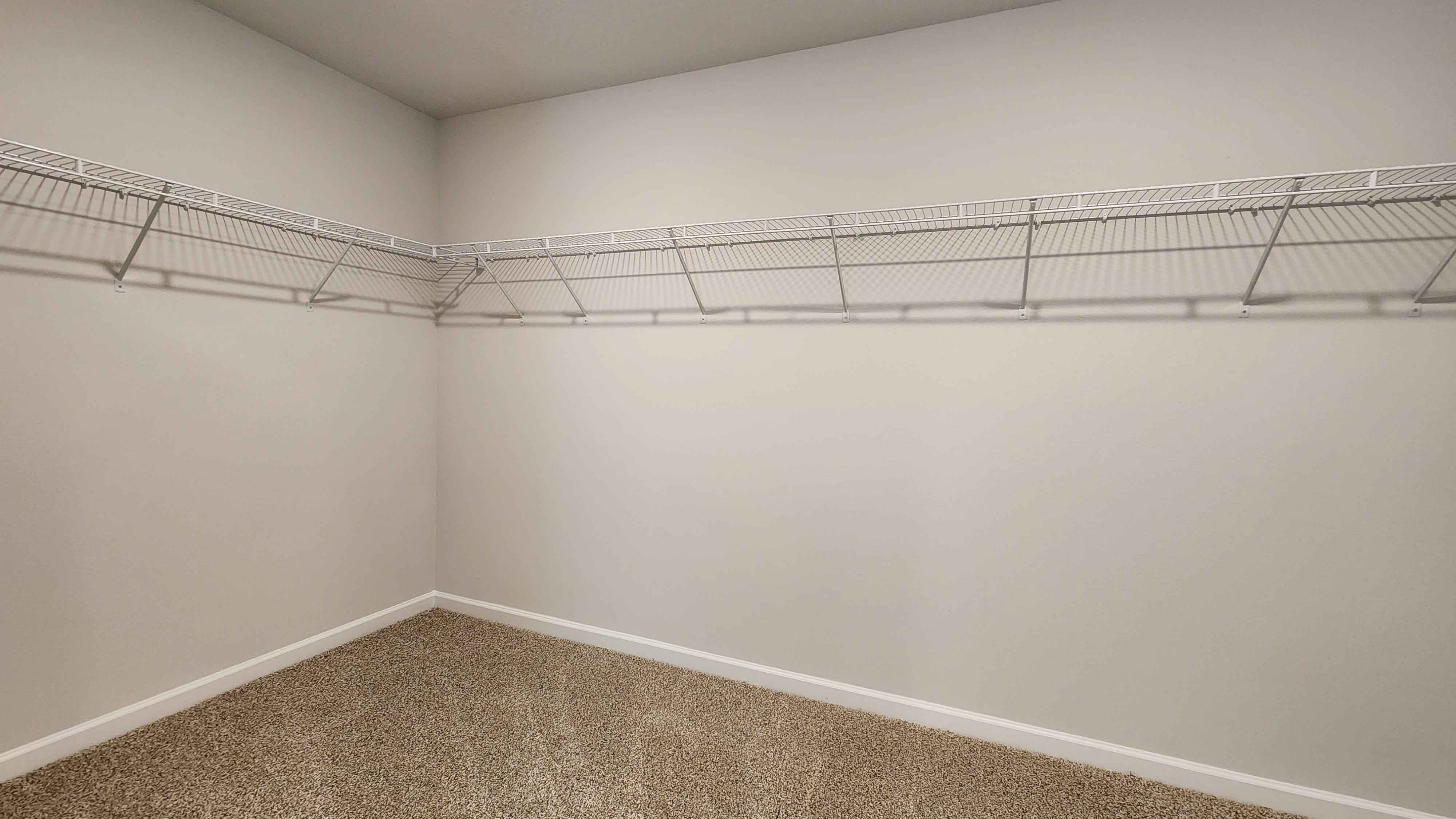 Spacious walk in closet inside primary suite