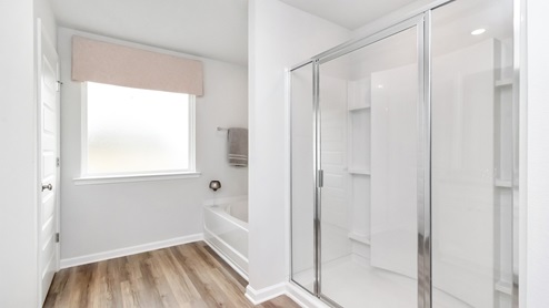 primary bathroom lit up with natural lighting