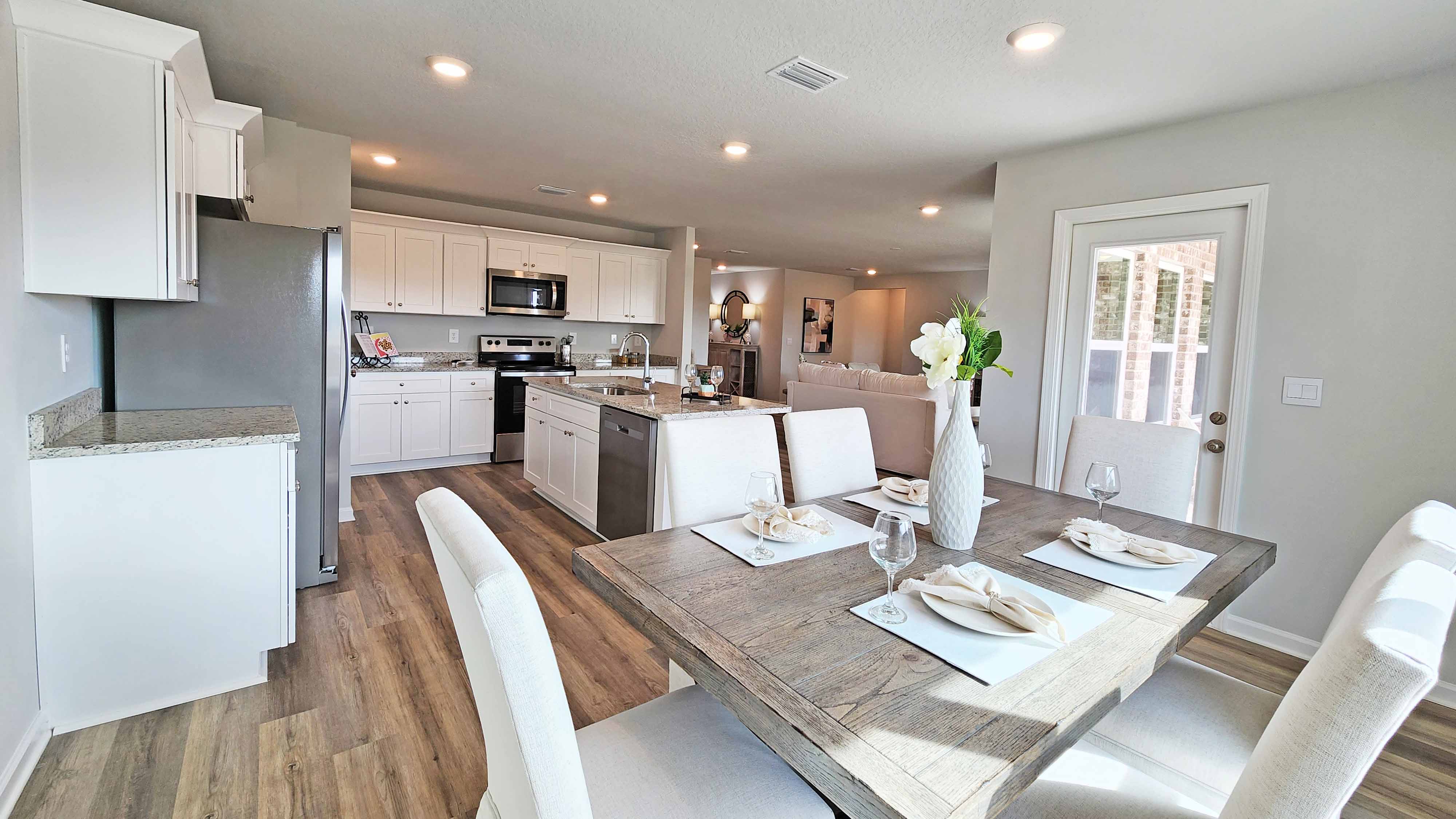 Dining area with open-concept layout and luxury finishes