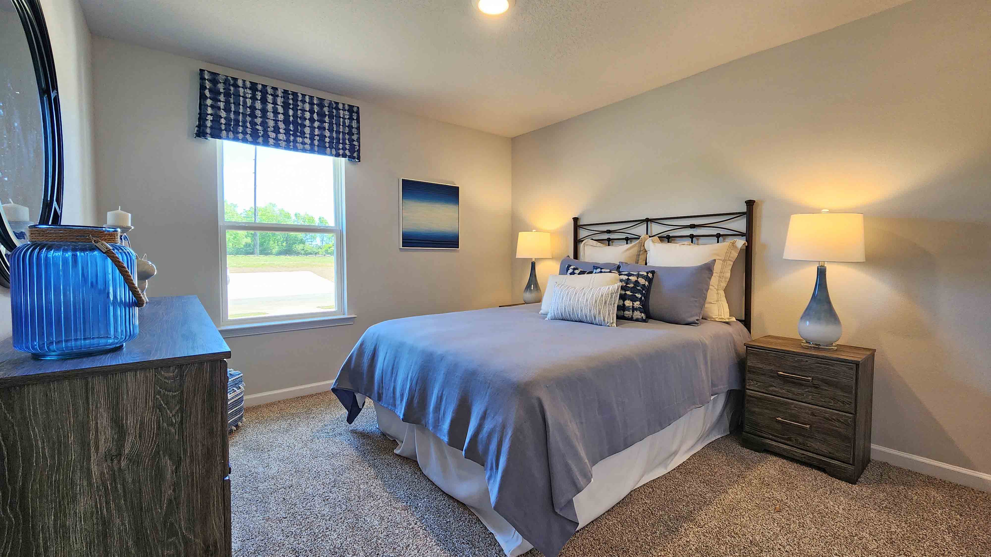 Comfortable guest room in a newly built D.R. Horton home.