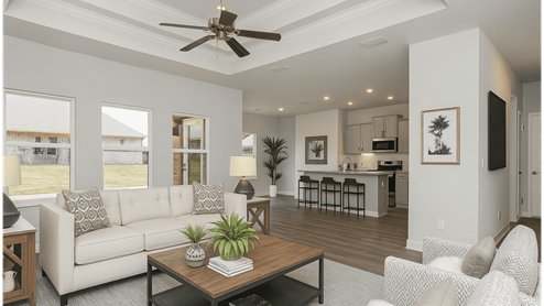 Open living area with ceiling fan and neutral furnishings in Mobile.