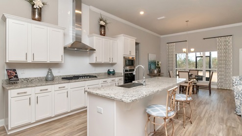Side angle of the kitchen inside of Dees Plantation model home.