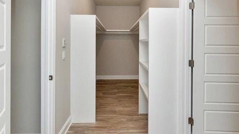 Beautiful walk in closet in the primary bathroom.