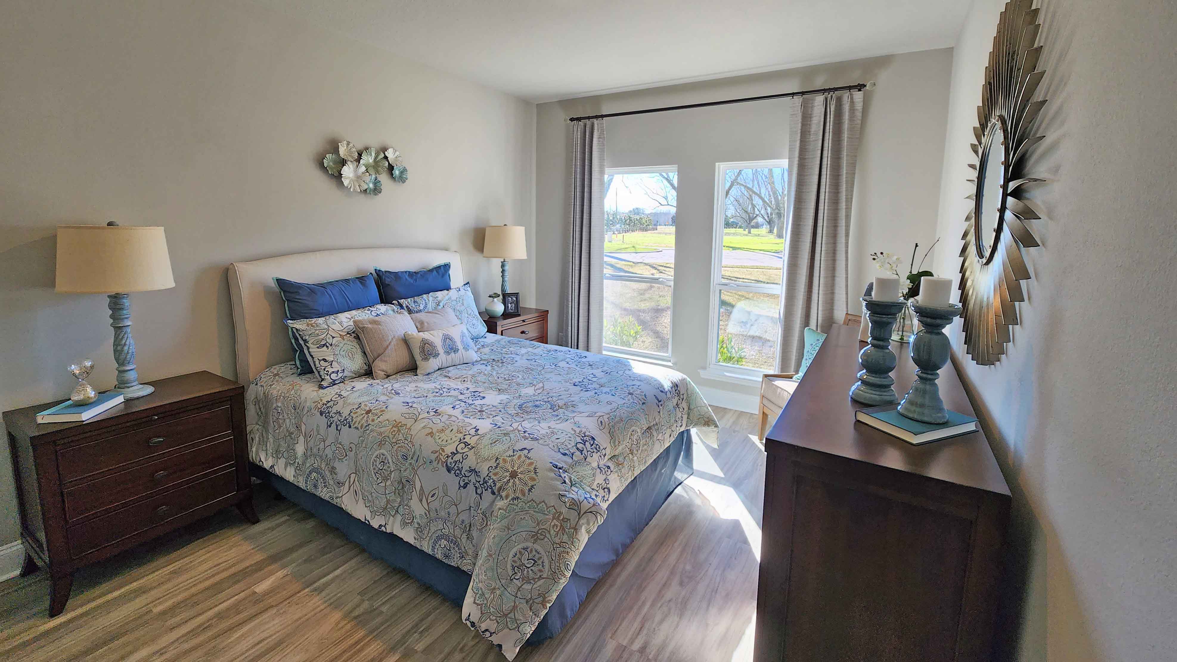 Bedroom with a window and a simple furnishings.