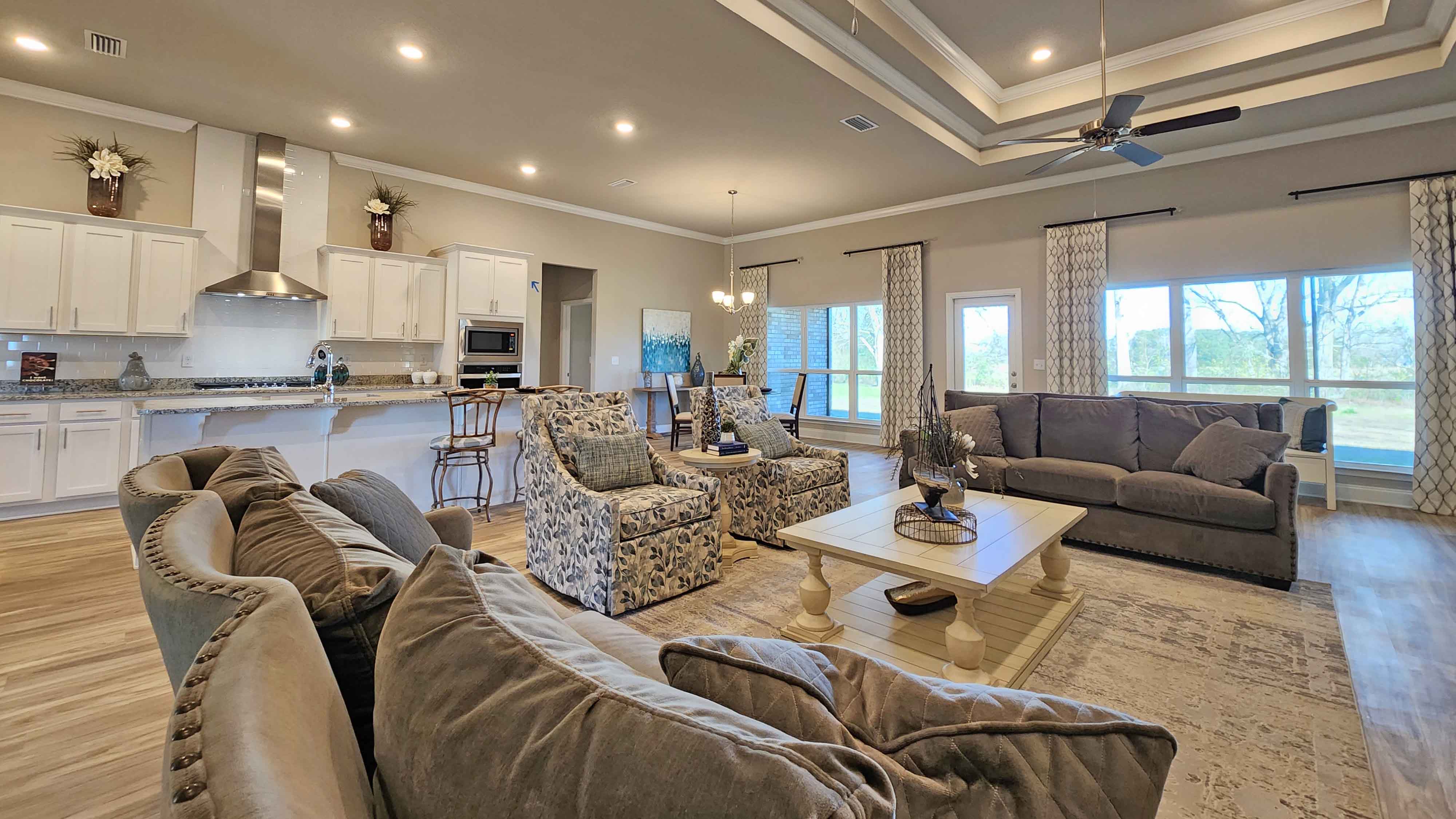Open concept living space with natural light and simple furnishings.