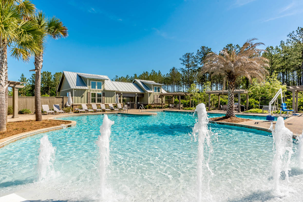 Zero-entry, resort-style pool with water fountains.