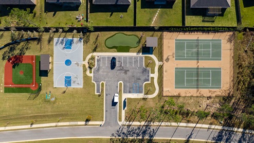 Aerial view of tennis and basketball courts.