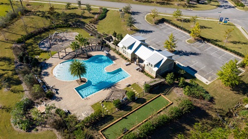 Zero-entry, resort-style pool with water fountains.