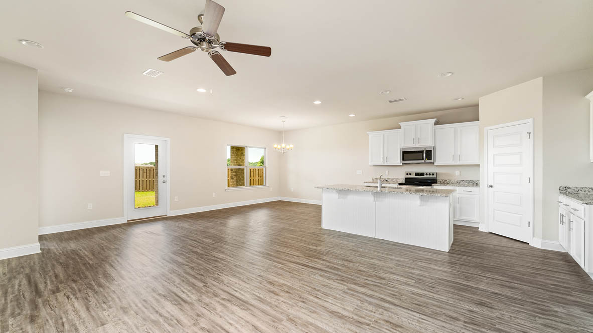 Living room with dining room and kitchen in back