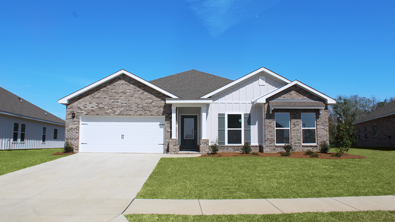 Single-story home with brick and board and batten exterior and a two-car garage.