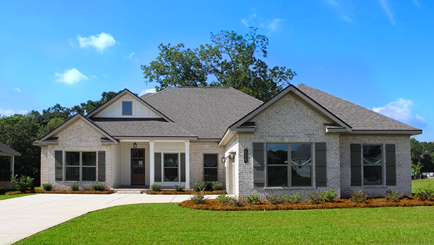 Two-story brick new home with board and batten accents and contrasting Hardie shutters with a two-car courtyard garage.