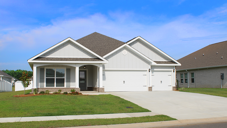 Single-story home with a covered front porch, brick accents, board and batten, and a two-car garage.