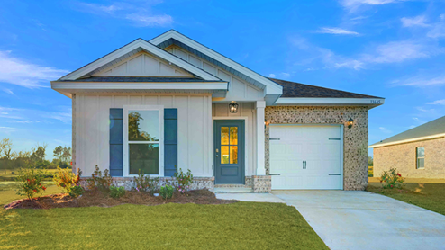 Single-story home with board and batten exterior, a brick water table, craftsman lighting, and a single car garage.