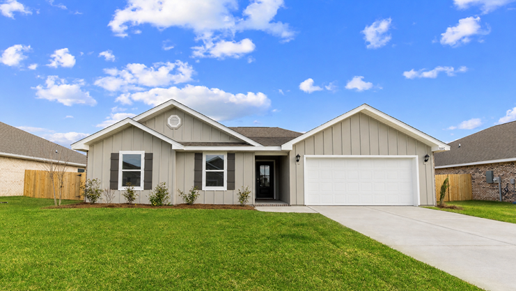 Single-story home with board and batten exterior and a two-car garage.