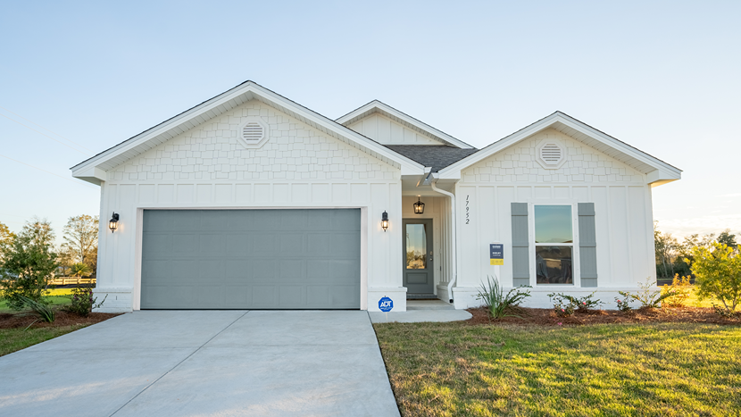 Single-story home with a painted two-car garage.