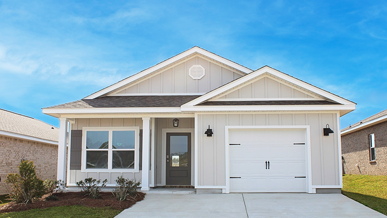Single-story home with board and batten exterior, a covered front porch, and a one-car garage.