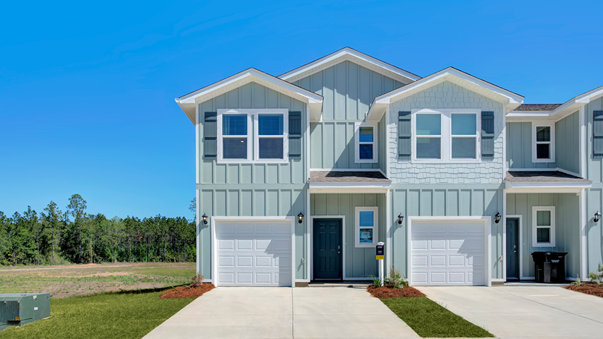 Two-story town home with a one-car garage.