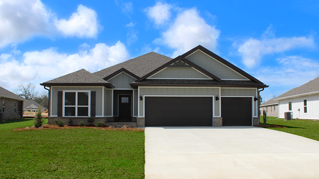 One-story home with a painted three-car garage.