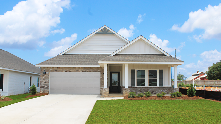 Single-story home with a covered front porch and two-car garage.
